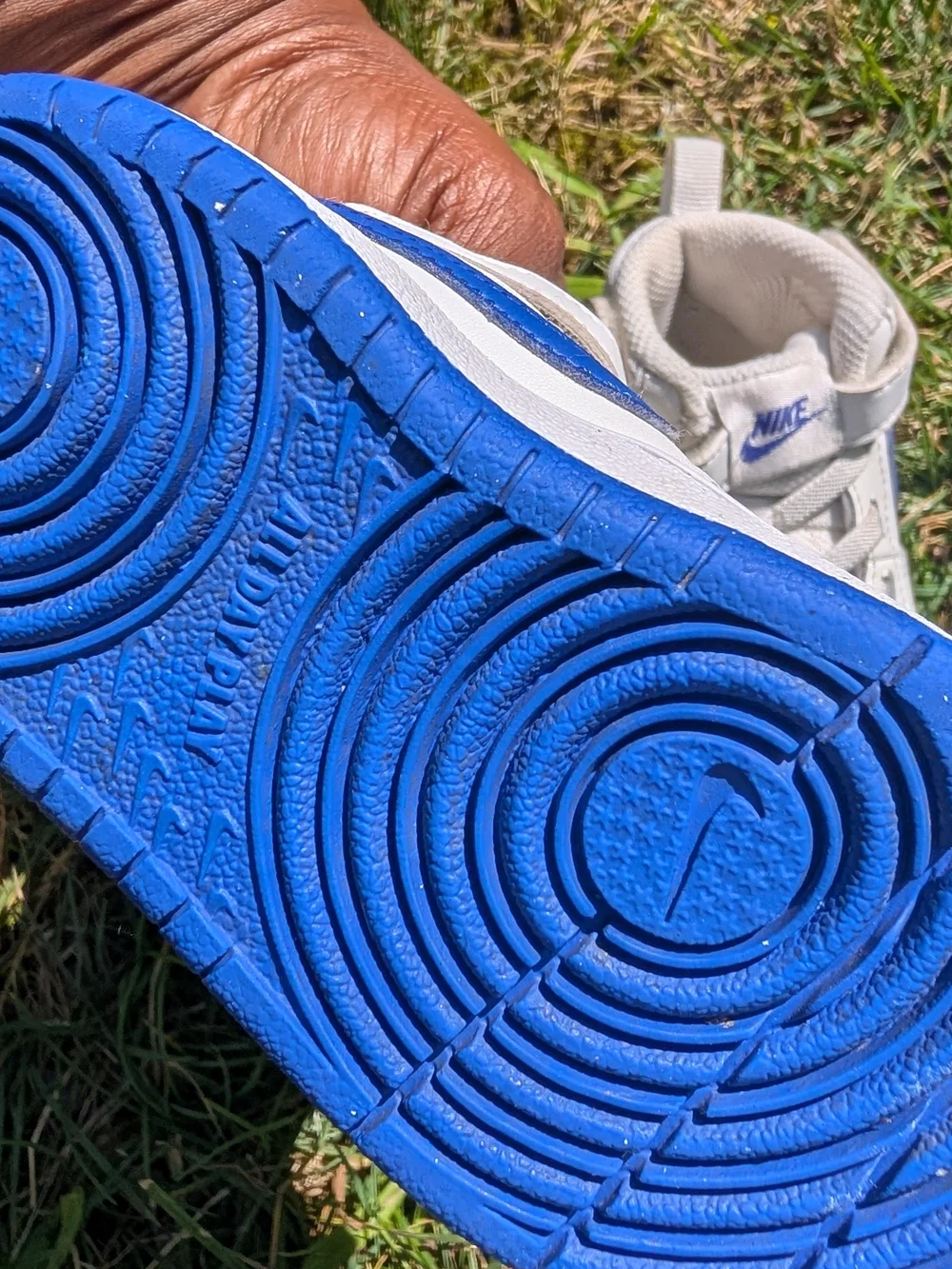 Nike Toddler White Sneakers with Blue Swoosh